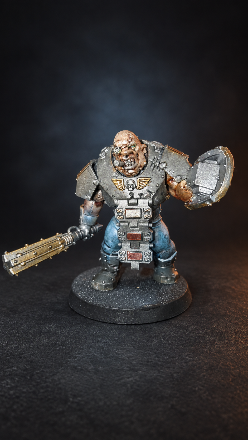 Armored Ogryn miniature with club and shield